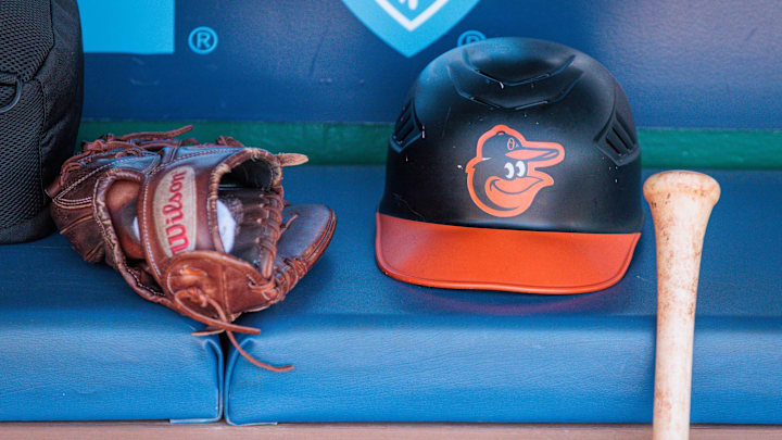 Apr 21, 2024; Kansas City, Missouri, USA; Baltimore Orioles hat and glove sits in the dugout during the ninth inning against the Kansas City Royals at Kauffman Stadium. Apr 21, 2024; Kansas City, Missouri, USA; Baltimore Orioles hat and glove sits in the dugout during the ninth inning against the Kansas City Royals at Kauffman Stadium.
