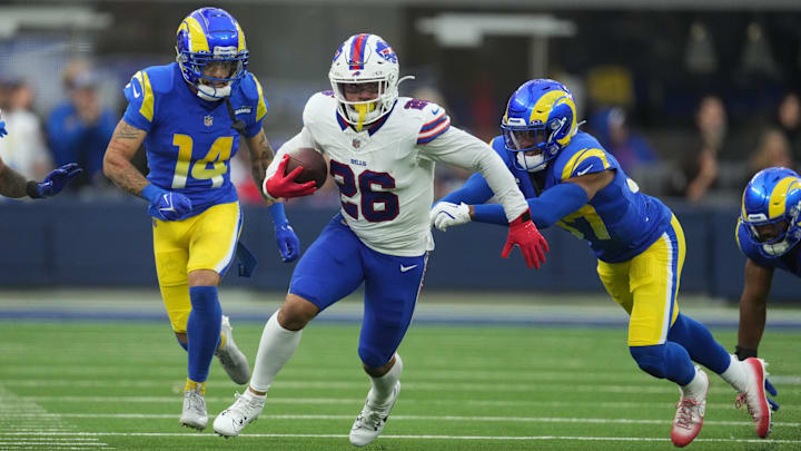 Dec 8, 2024; Inglewood, California, USA; Buffalo Bills running back Ty Johnson (26) carries the ball against Los Angeles Rams cornerback Cobie Durant (14) and safety Quentin Lake (37) Dec 8, 2024; Inglewood, California, USA; Buffalo Bills running back Ty Johnson (26) carries the ball against Los Angeles Rams cornerback Cobie Durant (14) and safety Quentin Lake (37)