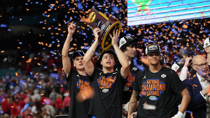 Apr 7, 2025; San Antonio, TX, USA; Florida Gators guard Walter Clayton Jr. (1) holds up the trophy after winning the national championship game of the Final Four of the 2025 NCAA Tournament at the Alamodome. Mandatory Credit: Bob Donnan-Imagn Images