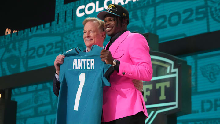 Apr 24, 2025; Green Bay, WI, USA; NFL commissioner Roger Goodell stands with Colorado Buffaloes wide receiver Travis Hunter after he is selected by the Jacksonville Jaguars as the number two pick in the first round of the 2025 NFL Draft at Lambeau Field. Mandatory Credit: Kirby Lee-Imagn Images Apr 24, 2025; Green Bay, WI, USA; NFL commissioner Roger Goodell stands with Colorado Buffaloes wide receiver Travis Hunter after he is selected by the Jacksonville Jaguars as the number two pick in the first round of the 2025 NFL Draft at Lambeau Field. Mandatory Credit: Kirby Lee-Imagn Images