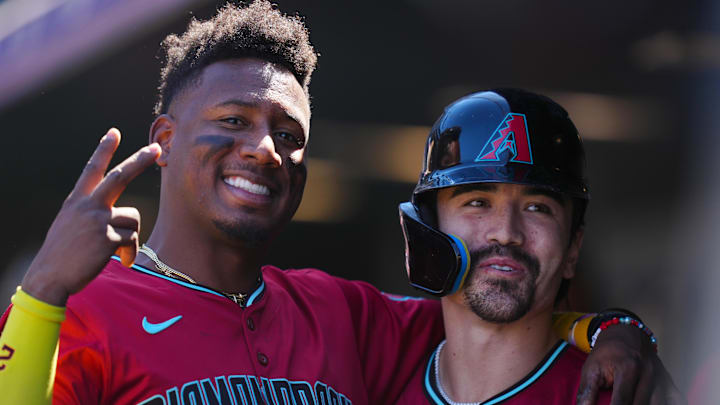 Sep 18, 2024; Denver, Colorado, USA; Arizona Diamondbacks outfielder Corbin Carroll (7) (right) celebrates his solo home run with shortstop Geraldo Perdomo (2) (left) in the first inning against the Colorado Rockies at Coors Field. Mandatory Credit: Ron Chenoy-Imagn Images Sep 18, 2024; Denver, Colorado, USA; Arizona Diamondbacks outfielder Corbin Carroll (7) (right) celebrates his solo home run with shortstop Geraldo Perdomo (2) (left) in the first inning against the Colorado Rockies at Coors Field. Mandatory Credit: Ron Chenoy-Imagn Images