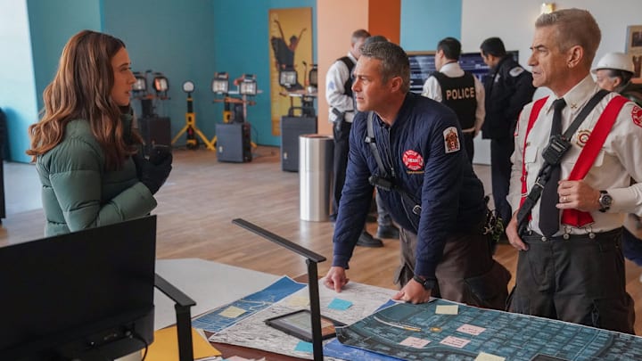 CHICAGO P.D. -- "In The Trenches: Part III" Episode 12014 -- Pictured: (l-r) Marina Squerciati as Officer Kim Burgess, Taylor Kinney as Kelly Severide, Dermot Mulroney as Chief Dom Pascal -- (Photo by: Elizabeth Sisson/NBC)