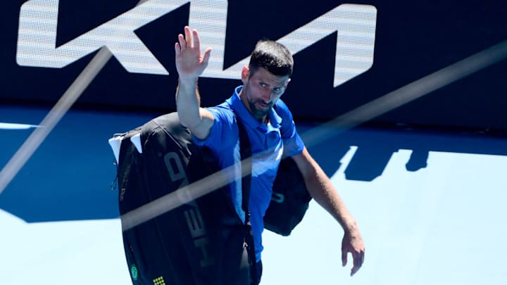 Novak Djokovic waves to the crowd after retiring during the semifinals of the Australian Open.
