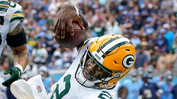 Green Bay Packers quarterback Malik Willis (2) scores a touchdown past Tennessee Titans cornerback Roger McCreary (21) during the first quarter at Nissan Stadium in Nashville, Tenn., Sunday, Sept. 22, 2024.