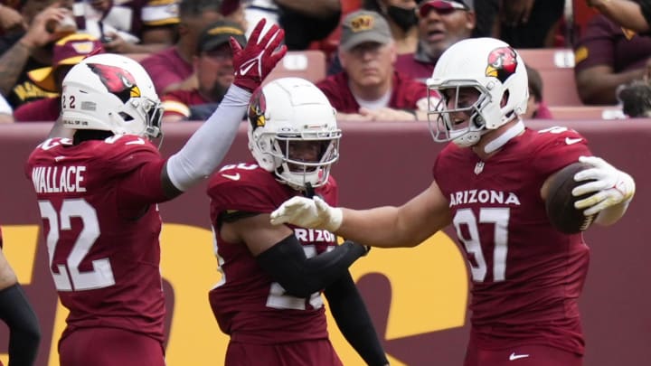 Sep 10, 2023; Landover, Maryland, USA; Arizona Cardinals safety K'Von Wallace (22) cornerback Marco Wilson (20) and linebacker Cameron Thomas (97) celebrate after scoring a touchdown against the Washington Commanders in the second half at FedExField. Mandatory Credit: Brent Skeen-USA TODAY Sports