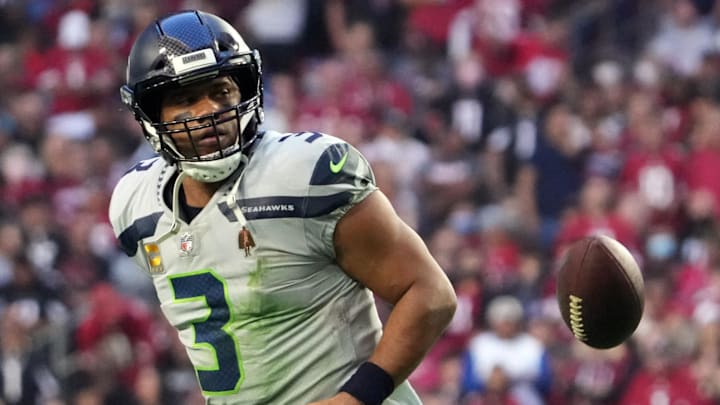 Jan 9, 2022; Glendale, Arizona, USA; Seattle Seahawks quarterback Russell Wilson (3) flips the ball after scoring a touchdown against the Arizona Cardinals during the second half at State Farm Stadium. Mandatory Credit: Joe Camporeale-Imagn Images Jan 9, 2022; Glendale, Arizona, USA; Seattle Seahawks quarterback Russell Wilson (3) flips the ball after scoring a touchdown against the Arizona Cardinals during the second half at State Farm Stadium. Mandatory Credit: Joe Camporeale-Imagn Images