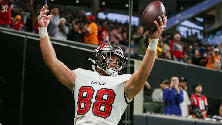 Dec 10, 2023; Atlanta, Georgia, USA; Tampa Bay Buccaneers tight end Cade Otton (88) celebrates after a touchdown catch against the Atlanta Falcons in the second half at Mercedes-Benz Stadium. Mandatory Credit: Brett Davis-Imagn Images