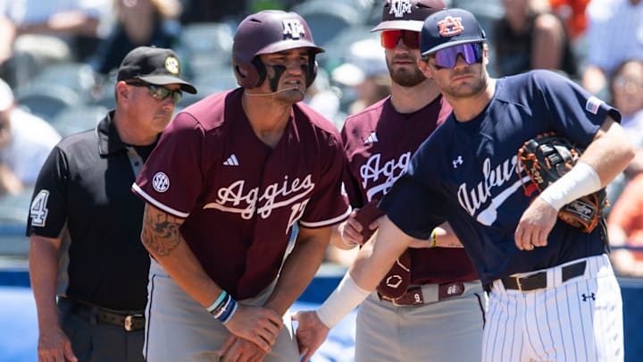 Auburn Tigers' Cooper McMurray (26) encourages Texas A&M Aggies' Jace LaViolette (17) after LaViolette got hit in the hands by a pitch as Auburn Tigers take on Texas A&M Aggies during the SEC baseball tournament at Hoover Met in Birmingham, Ala., on Thursday, May 22, 2025.