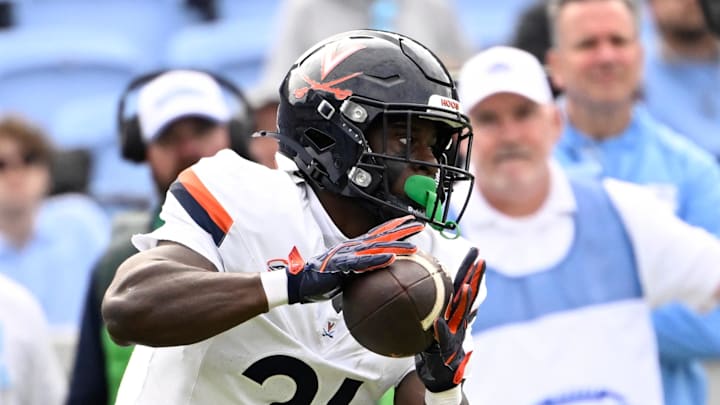 Oct 25, 2025; Chapel Hill, North Carolina, USA; Virginia Cavaliers running back Harrison Waylee (21) with the ball in the third quarter at Kenan Stadium. Mandatory Credit: Bob Donnan-Imagn Images