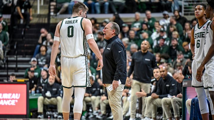 Michigan State's head coach Tom Izzo, right, talks with Jaxon Kohler during the first half in the game against Toledo on Tuesday, Dec. 16, 2025, at the Breslin Center in East Lansing.
