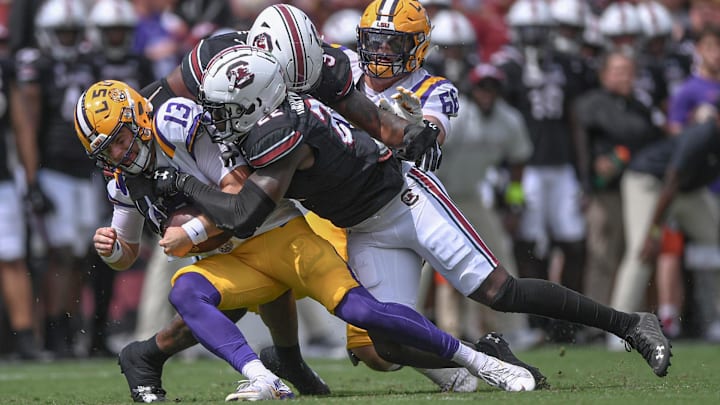 South Carolina linebacker Bam Martin-Scott (22) sacks Louisiana State University quarterback Garrett Nussmeier (13) during the first quarter at Williams-Brice Stadium in Columbia, S.C. Saturday, September 14, 2024.