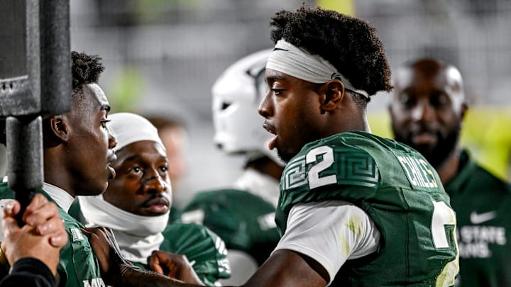 Michigan State's Aidan Chiles, right, talks with Nick Marsh, left, and Omari Kelly on the sideline during the fourth quarter in the game against Western Michigan on Friday, Aug. 29, 2025, in East Lansing.
