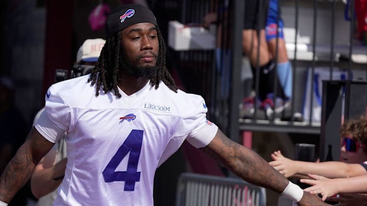 RB James Cook runs by slapping hands with outstretched hands as he heads to the field during the Buffalo Bills training camp. RB James Cook runs by slapping hands with outstretched hands as he heads to the field during the Buffalo Bills training camp.