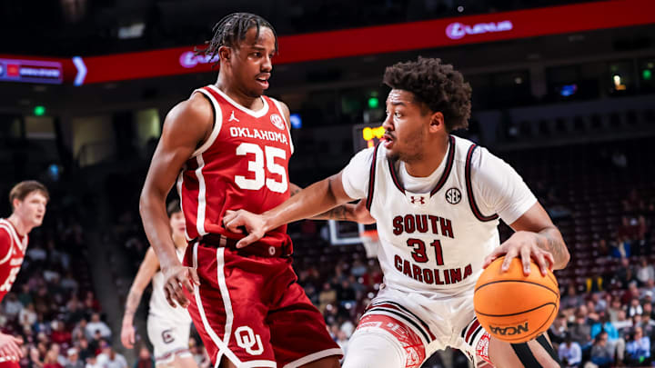 South Carolina Gamecocks forward Elijah Strong (31) looks to drive around Oklahoma Sooners forward Derrion Reid (35) in the first half at Colonial Life Arena.