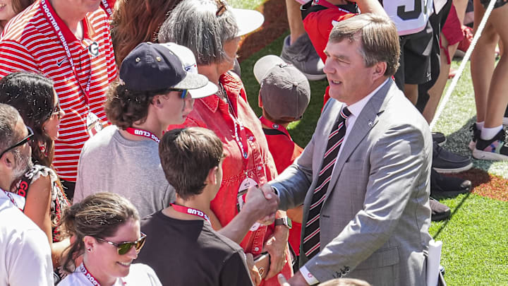 Sep 7, 2024; Athens, Georgia, USA; Georgia Bulldogs head coach Kirby Smart reacts with fans walking in during the Dawgwalk prior to the game  against the Tennessee Tech Golden Eagles at Sanford Stadium. Mandatory Credit: Dale Zanine-Imagn Images