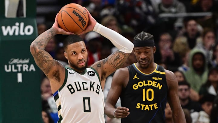 Feb 10, 2025; Milwaukee, Wisconsin, USA; Milwaukee Bucks guard Damian Lillard (0) reacts after a foul call in the third quarter against the Golden State Warriors at Fiserv Forum. Mandatory Credit: Benny Sieu-Imagn Images
