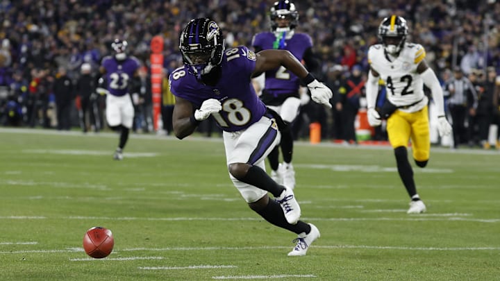 Jan 11, 2025; Baltimore, Maryland, USA; Baltimore Ravens wide receiver Steven Sims (18) muffs a punt return as Pittsburgh Steelers cornerback James Pierre (42) chases in an AFC wild card game at M&T Bank Stadium. Mandatory Credit: Geoff Burke-Imagn Images Jan 11, 2025; Baltimore, Maryland, USA; Baltimore Ravens wide receiver Steven Sims (18) muffs a punt return as Pittsburgh Steelers cornerback James Pierre (42) chases in an AFC wild card game at M&T Bank Stadium. Mandatory Credit: Geoff Burke-Imagn Images