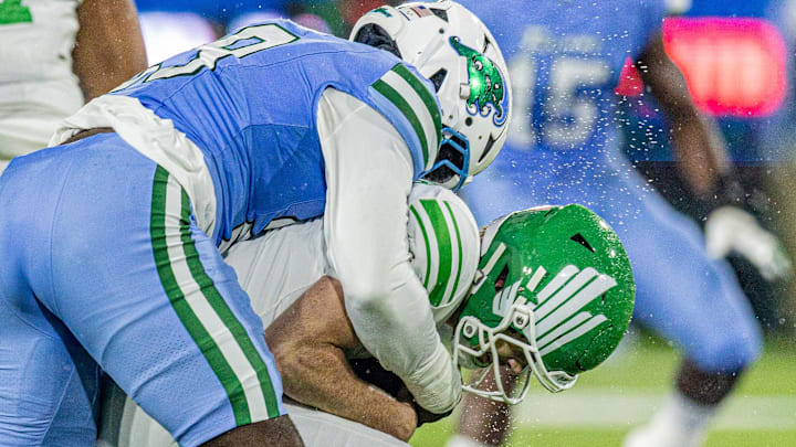 Tulane Green Wave defensive lineman Santana Hopper (29) sacks North Texas Mean Green quarterback Drew Mestemaker (17) during the first half in the 2025 American Championship.