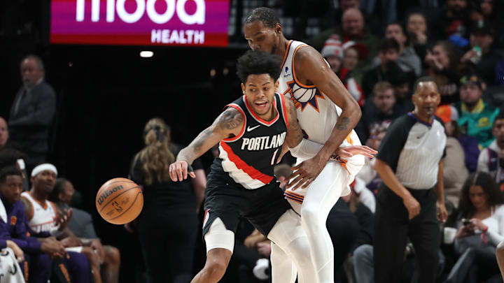 Jan 14, 2024; Portland, Oregon, USA;  Portland Trail Blazers guard Anfernee Simons (1) reacts after drawing a foul against Phoenix Suns forward Kevin Durant (35) in the third quarter at Moda Center. Mandatory Credit: Jaime Valdez-Imagn Images