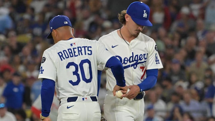 Sep 16, 2025; Los Angeles, California, USA; Los Angeles Dodgers manager Dave Roberts (30) pulls relief pitcher Justin Wrobleski (70) during the sixth inning against the Philadelphia Phillies at Dodger Stadium. Mandatory Credit: Jayne Kamin-Oncea-Imagn Images