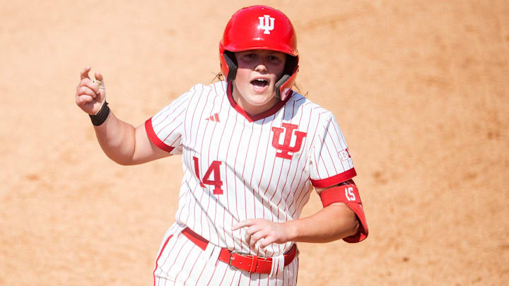Indiana's Sarah Stone (14) celebrates hitting a homer as she rounds second base during a NCAA Regional softball game between Indiana and Louisville at Sherri Parker Lee Stadium in Knoxville, Tenn., on Friday, May 19, 2023.