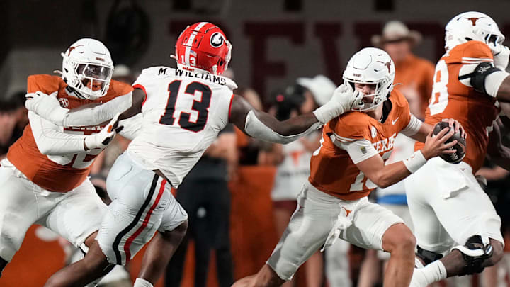Georgia Bulldogs defensive lineman Mykel Williams face masks Texas Longhorns quarterback Arch Manning in the second quarter at Darrell K Royal-Texas Memorial Stadium Saturday October 19, 2024.