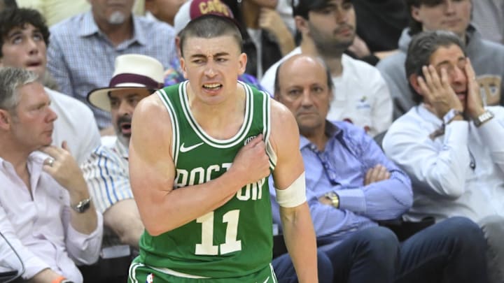 May 13, 2024; Cleveland, Ohio, USA; Boston Celtics guard Payton Pritchard (11) celebrates his three-point basket in the third quarter of game four of the second round for the 2024 NBA playoffs against the Cleveland Cavaliers at Rocket Mortgage FieldHouse. Mandatory Credit: David Richard-Imagn Images