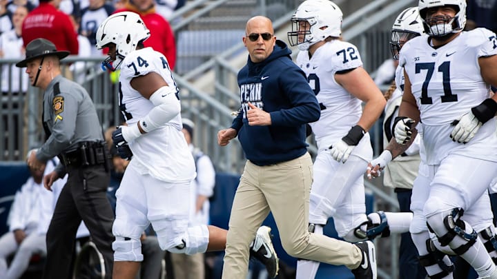 Penn State football head coach James Franklin leads the team onto the field at the start of the Blue-White game.