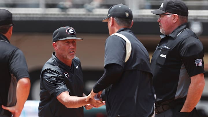 Georgia coach Wes Johnson shakes hand with Army coach Chris Tracz before a NCAA Athens Regional baseball game against Army in Athens, Ga., on Friday, May 31, 2024. Georgia won 8-7.