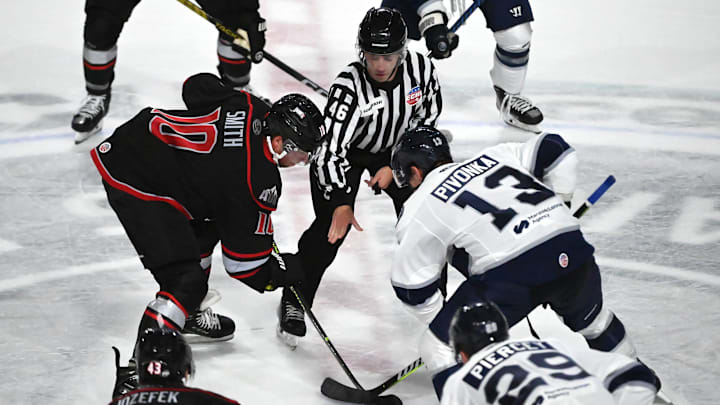 Worcester Railers center Jake Pivonka (13) faces off against the Adirondack Thunder's Ryan Smith.