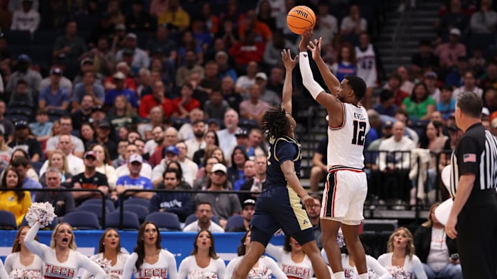 Mar 20, 2026; Tampa, FL, USA; Texas Tech Red Raiders forward Donovan Atwell (12) shoots against Akron Zips guard Tavari Johnson (5) in the second half during a first round game of the men's 2026 NCAA Tournament at Benchmark International Arena. Mandatory Credit: Matt Pendleton-Imagn Images Mar 20, 2026; Tampa, FL, USA; Texas Tech Red Raiders forward Donovan Atwell (12) shoots against Akron Zips guard Tavari Johnson (5) in the second half during a first round game of the men's 2026 NCAA Tournament at Benchmark International Arena. Mandatory Credit: Matt Pendleton-Imagn Images