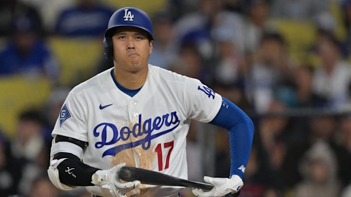 Apr 1, 2026; Los Angeles, California, USA;  Los Angeles Dodgers two-way player Shohei Ohtani (17) reacts after he was called out on a checked swing with bases loaded to end in the eighth inning against the Cleveland Guardians at Dodger Stadium. Mandatory Credit: Jayne Kamin-Oncea-Imagn Images