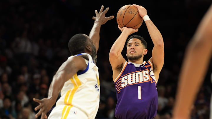 Apr 8, 2025; Phoenix, Arizona, USA; Phoenix Suns guard Devin Booker (1) shoots the ball over Golden State Warriors forward Draymond Green (23) during the second half at Footprint Center. Mandatory Credit: Mark J. Rebilas-Imagn Images Apr 8, 2025; Phoenix, Arizona, USA; Phoenix Suns guard Devin Booker (1) shoots the ball over Golden State Warriors forward Draymond Green (23) during the second half at Footprint Center. Mandatory Credit: Mark J. Rebilas-Imagn Images