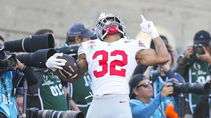 Ohio State Buckeyes running back TreVeyon Henderson (32) celebrates a touchdown during the first half of the College Football Playoff quarterfinal against the Oregon Ducks at the Rose Bowl in Pasadena, Calif. on Jan. 1, 2025. Ohio State Buckeyes running back TreVeyon Henderson (32) celebrates a touchdown during the first half of the College Football Playoff quarterfinal against the Oregon Ducks at the Rose Bowl in Pasadena, Calif. on Jan. 1, 2025.