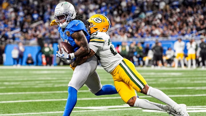 Detroit Lions running back Jahmyr Gibbs (0) makes a catch against Green Bay Packers cornerback Keisean Nixon (25) during the second half at Ford Field in Detroit on Thursday, Nov. 27, 2025. Detroit Lions running back Jahmyr Gibbs (0) makes a catch against Green Bay Packers cornerback Keisean Nixon (25) during the second half at Ford Field in Detroit on Thursday, Nov. 27, 2025.