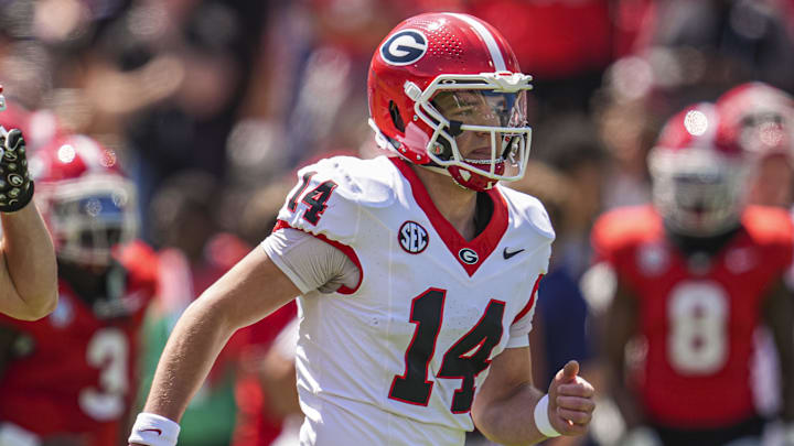 Apr 12, 2025; Athens, GA, USA; Georgia Bulldogs quarterback Gunner Stockton (14) runs on the field prior to the start of the Georgia Spring game at Sanford Stadium. Mandatory Credit: Dale Zanine-Imagn Images
