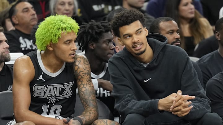 Dec 5, 2024; San Antonio, Texas, USA; Injured San Antonio Spurs center Victor Wembanyama (1) talks with forward Jeremy Sochan (10) during the first half at Frost Bank Center. Mandatory Credit: Scott Wachter-Imagn Images Dec 5, 2024; San Antonio, Texas, USA; Injured San Antonio Spurs center Victor Wembanyama (1) talks with forward Jeremy Sochan (10) during the first half at Frost Bank Center. Mandatory Credit: Scott Wachter-Imagn Images