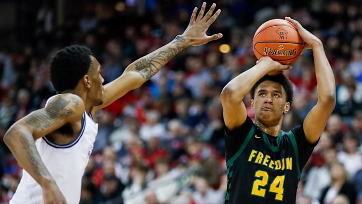 Freedom High School's Donovan Davis (24) shoots the ball against Milwaukee Academy of Science during the WIAA Division 3 state championship game on Saturday, March 22, 2025, at the Kohl Center in Madison, Wis. Milwaukee Academy of Science won the game, 57-54.
Tork Mason/USA TODAY NETWORK-Wisconsin