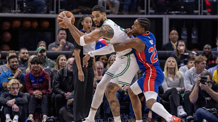Oct 26, 2024; Detroit, Michigan, USA; Boston Celtics forward Jayson Tatum (0) protects the ball late in the second half from Detroit Pistons guard Jaden Ivey (23) at Little Caesars Arena. Mandatory Credit: David Reginek-Imagn Images