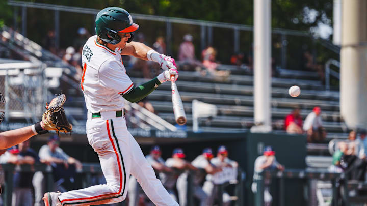 Miami's shortstop Jake Ogden smashing a homerun against UConn