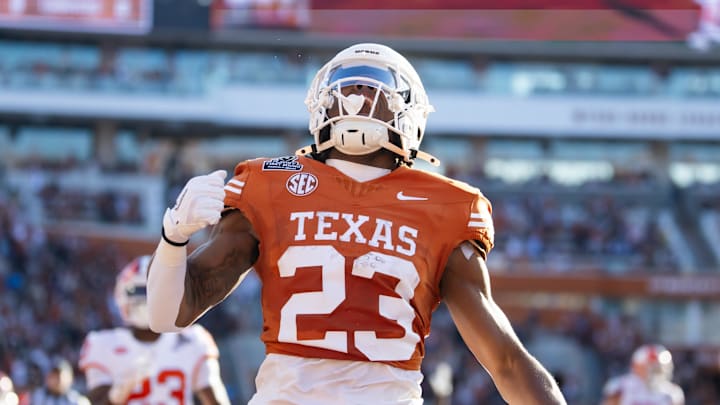 Dec 21, 2024; Austin, Texas, USA; Texas Longhorns running back Jaydon Blue (23) celebrates after scoring a touchdown against the Clemson Tigers during the first half of the CFP National playoff first round at Darrell K Royal-Texas Memorial Stadium. Mandatory Credit: Mark J. Rebilas-Imagn Imagesn Images