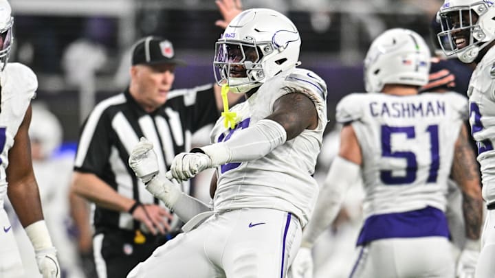 Dec 16, 2024; Minneapolis, Minnesota, USA; Minnesota Vikings linebacker Dallas Turner (15) reacts after a sack during the fourth quarter against the Chicago Bears at U.S. Bank Stadium.