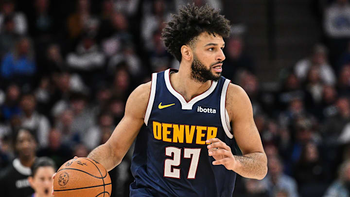 Jan 25, 2025; Minneapolis, Minnesota, USA; Denver Nuggets guard Jamal Murray (27) controls the ball against the Minnesota Timberwolves during the second quarter at Target Center. Mandatory Credit: Jeffrey Becker-Imagn Images