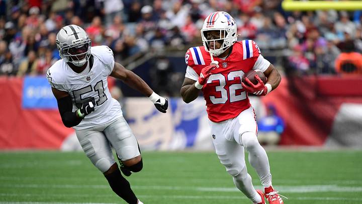 Oct 11, 2026; Foxborough, Massachusetts, USA;  New England Patriots running back TreVeyon Henderson (32) runs the ball against Las Vegas Raiders defensive end Malcolm Koonce (51) during the second quarter at Gillette Stadium.  Mandatory Credit: Bob DeChiara-Imagn Images
