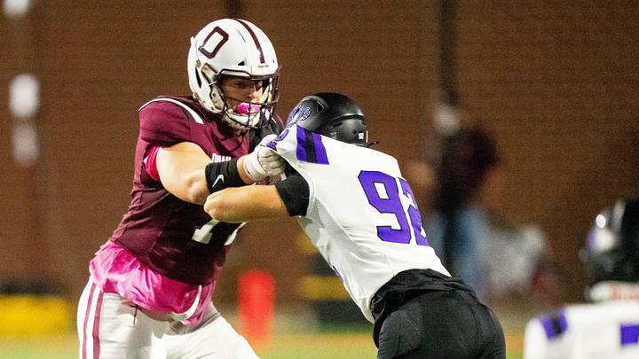 Dowling Catholic’s Carter Barrett (77) blocks during a game against Waukee on Oct. 10, 2025, at Valley Stadium in West Des Moines.