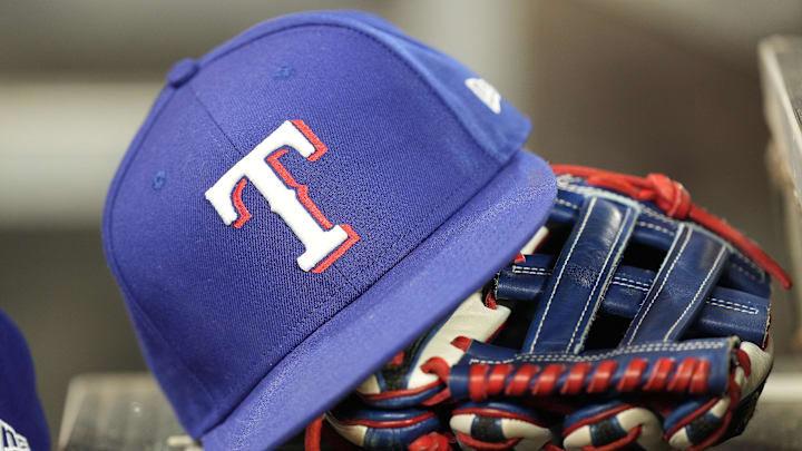 Jul 26, 2024; Toronto, Ontario, CAN; A hat and glove of a Texas Rangers player during a game against the Toronto Blue Jays at Rogers Centre. 