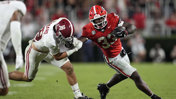 Sep 27, 2025; Athens, Georgia, USA;  Georgia Bulldogs running back Chauncey Bowens (33) runs against Alabama Crimson Tide defensive back Bray Hubbard (18) in the second half at Sanford Stadium. Mandatory Credit: Dale Zanine-Imagn Images