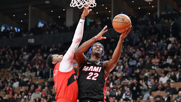 Dec 1, 2024; Toronto, Ontario, CAN; Miami Heat forward Jimmy Butler (22) shoots the ball as Toronto Raptors forward RJ Barrett (9) defends in the first half at Scotiabank Arena. Mandatory Credit: Dan Hamilton-Imagn Images Dec 1, 2024; Toronto, Ontario, CAN; Miami Heat forward Jimmy Butler (22) shoots the ball as Toronto Raptors forward RJ Barrett (9) defends in the first half at Scotiabank Arena. Mandatory Credit: Dan Hamilton-Imagn Images
