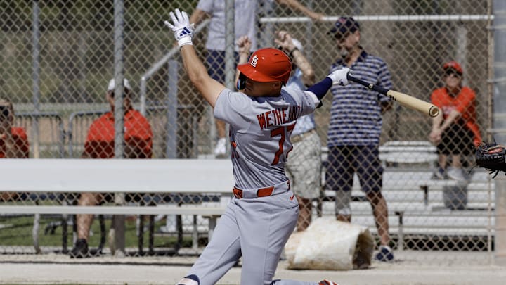 Feb 16, 2026; Jupiter, FL, USA;  St. Louis Cardinals infielder JJ Wetherholt (77) swings at a pitch during spring training workouts at Roger Dean Stadium. Mandatory Credit: Reinhold Matay-Imagn Images