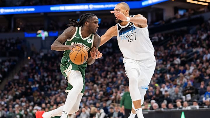 Milwaukee Bucks forward Taurean Prince dribbles against the Minnesota Timberwolves center Rudy Gobert in the third quarter at Target Center in Minneapolis on Feb. 12, 2025. 